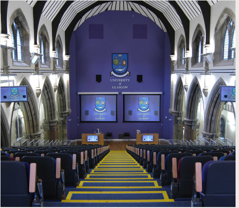 Venue for lectures. Image of the empty lecture taken from the central stairs at the back of the lecture theatre showing its distinct architectural features retained from when the building served as a church